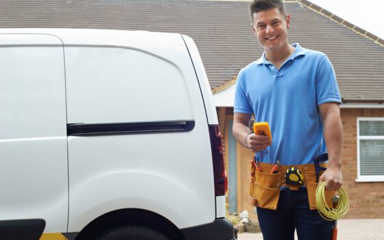 Portrait,Of,Electrician,With,Van,Outside,House
